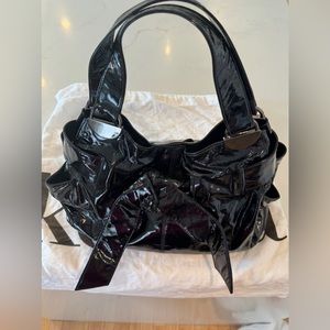 Kooba black patent leather shoulder bag.